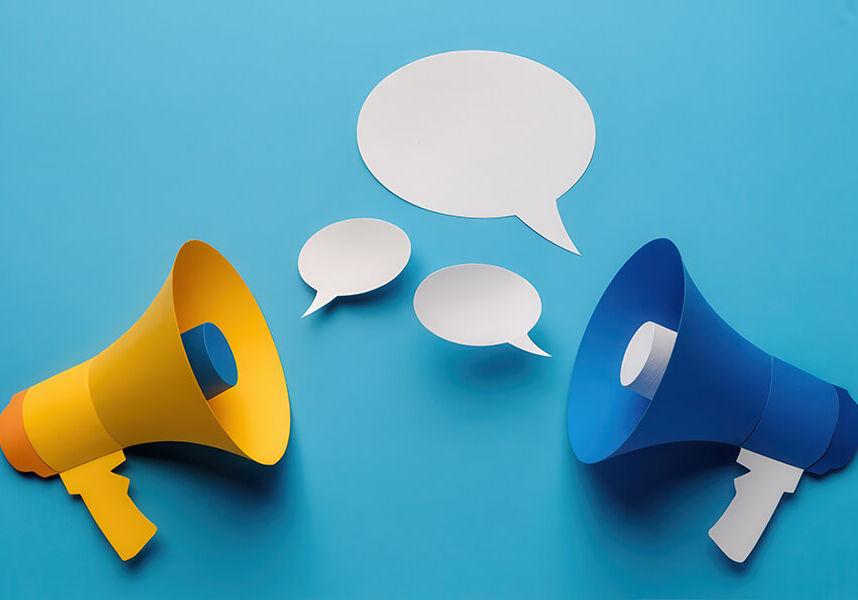 Two megaphones with speech bubbles on a blue background represen